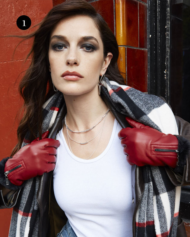 woman wearing touchscreen faux fur-lined leather gloves with zip in berry
