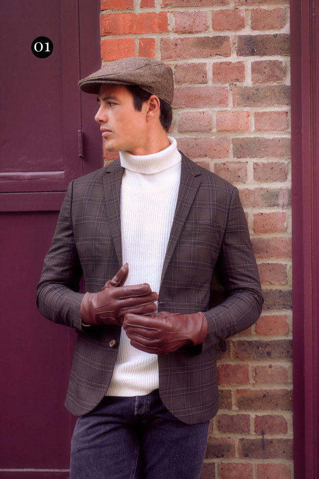 Man wearing brown leather gloves and tweed hat in chocolate