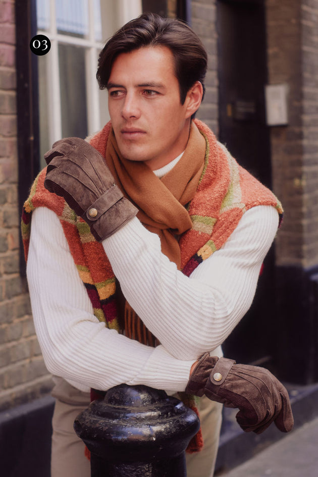 Men wearing suede brown leather gloves in the city