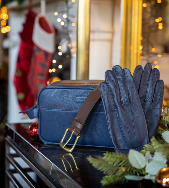 Gifts for him including leather gloves, belts and wash bag