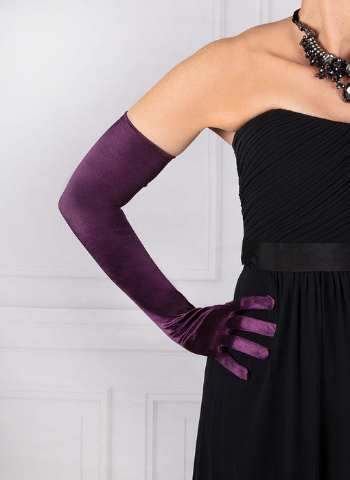 Woman wearing amethyst purple opera satin gloves with an evening dress