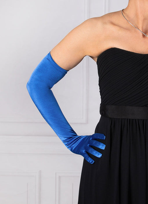 Woman wearing royal blue opera satin gloves with an evening dress