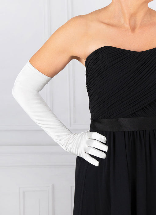 Woman wearing silver grey opera satin gloves with an evening dress