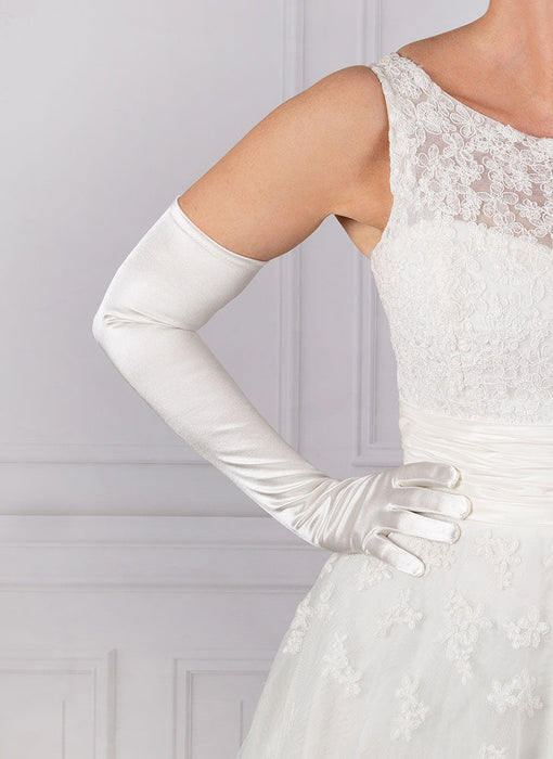 Woman wearing white opera satin gloves with a wedding dress