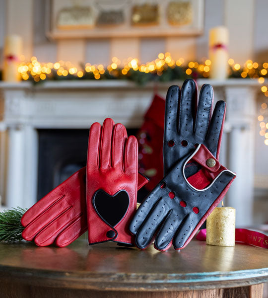 Leather gloves for him and her in a christmassy background