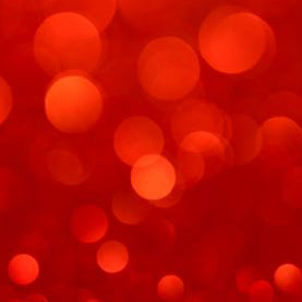 spots of light against a red background