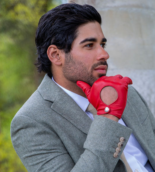 Man wearing heritage leather driving gloves in red