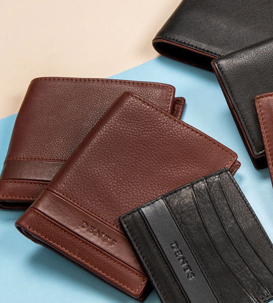 A collection of men's wallets in various colours and styles