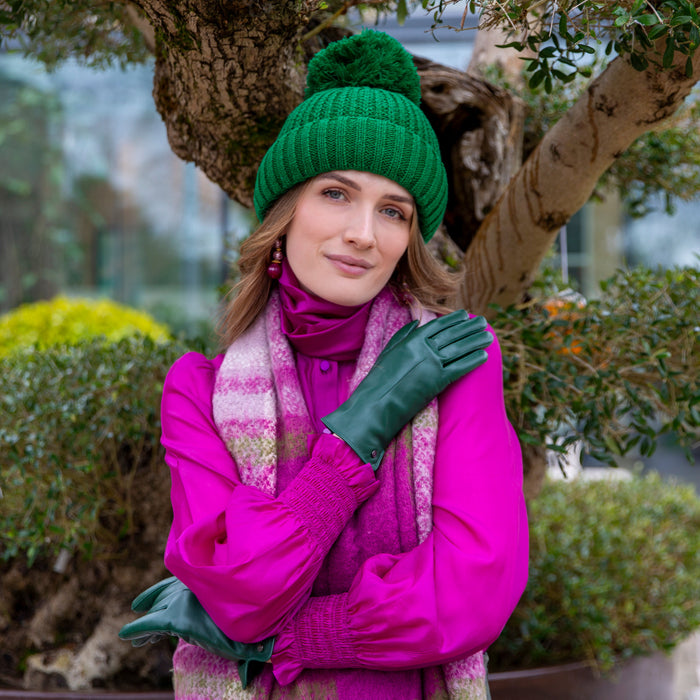 Woman wearing Fuchsia Plaid Check scarf with tassels in park