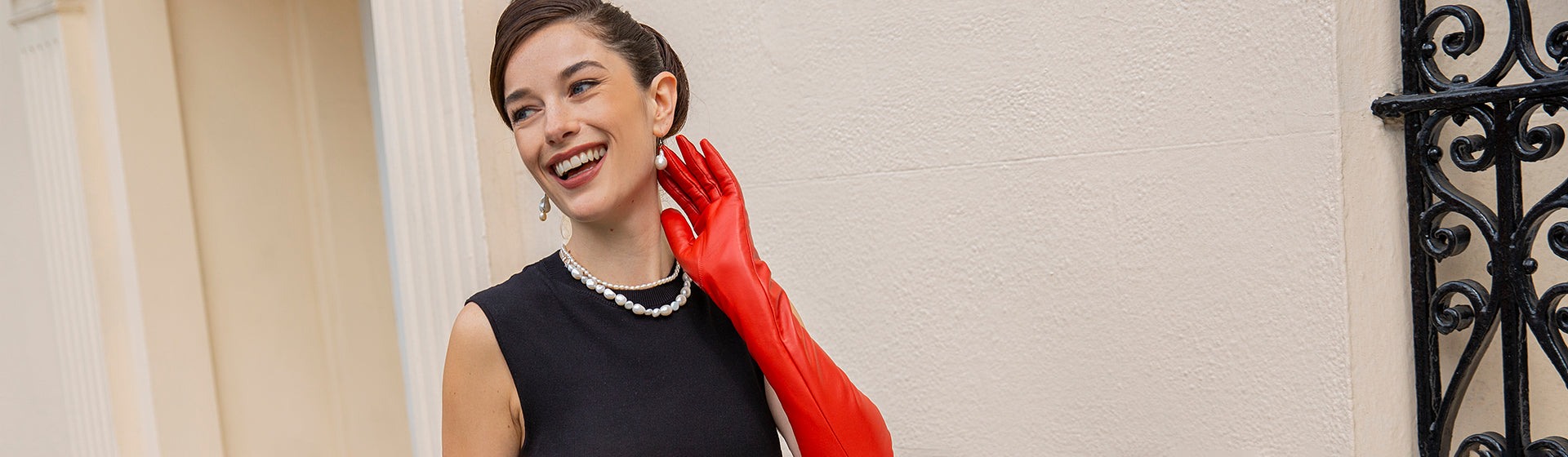 woman wearing long leather gloves in chilli walking down the street in london
