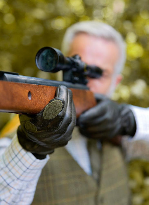 man shooting while wearing right hand shooting gloves