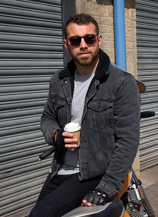 Man wearing Men's Fingerless Leather Driving Gloves in Black