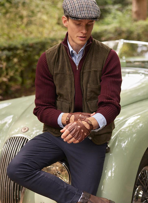 Man wearing Men's Fingerless Leather Driving Gloves in English Tan in the forest
