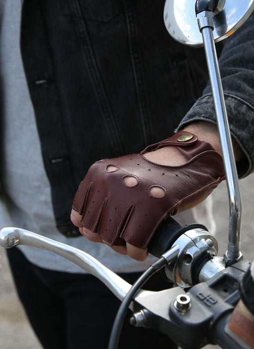 Man wearing Men's Fingerless Leather Driving Gloves in English Tan